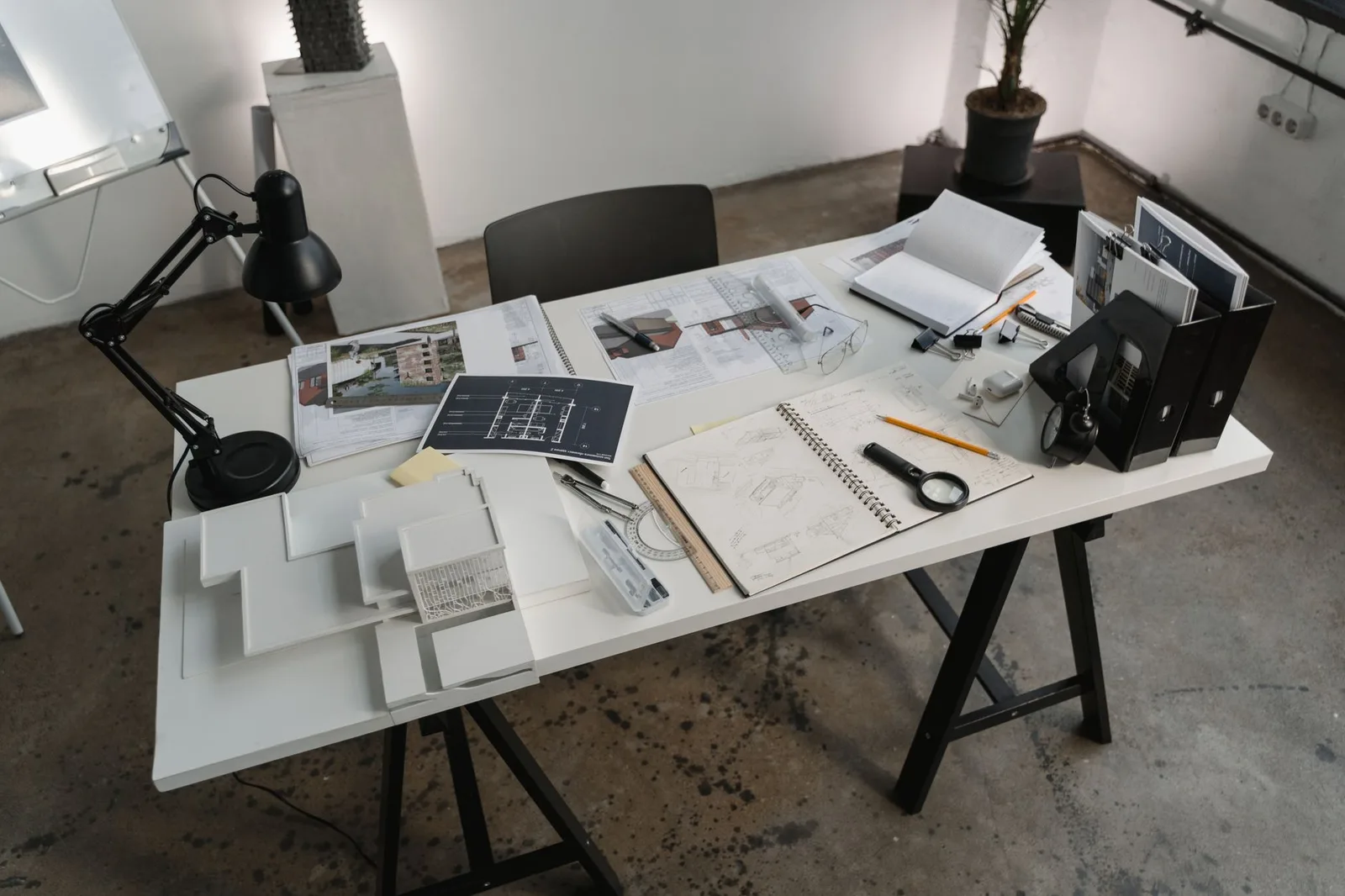 Blueprint and renovation plans on a desk