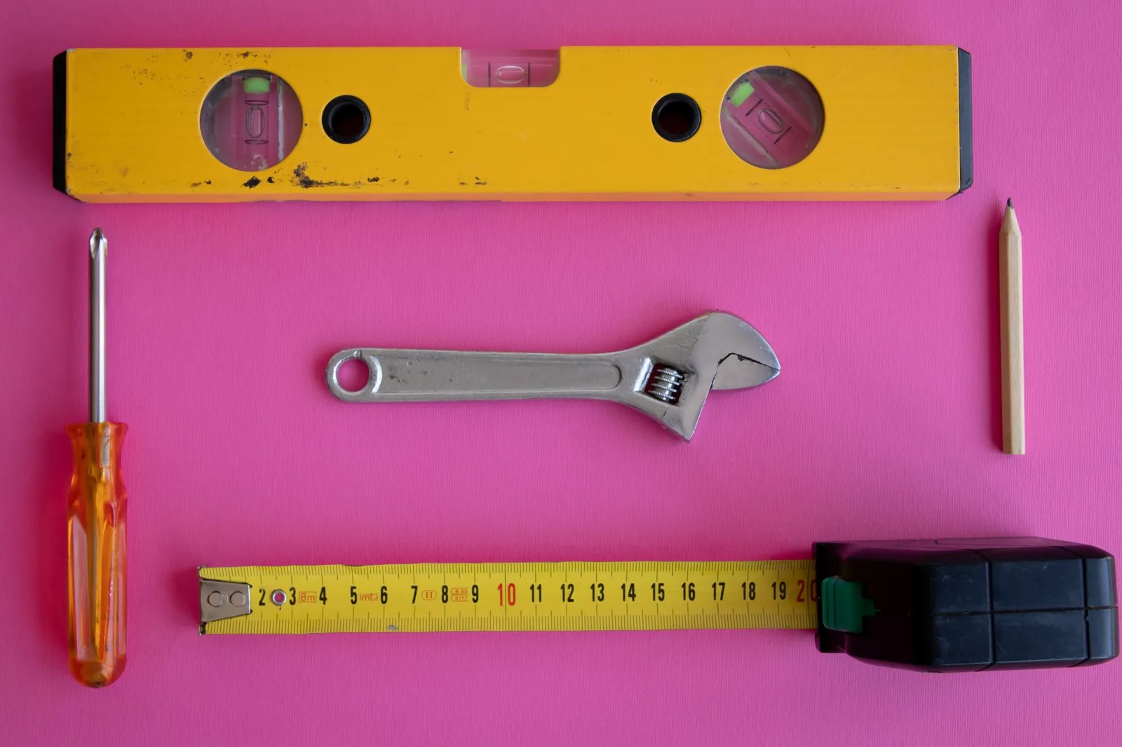 Measuring tape and level on a work surface