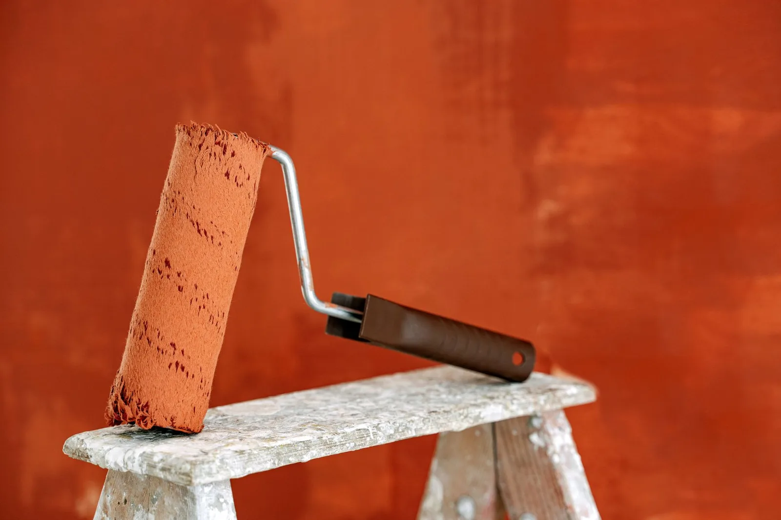Paint roller against an interior wall