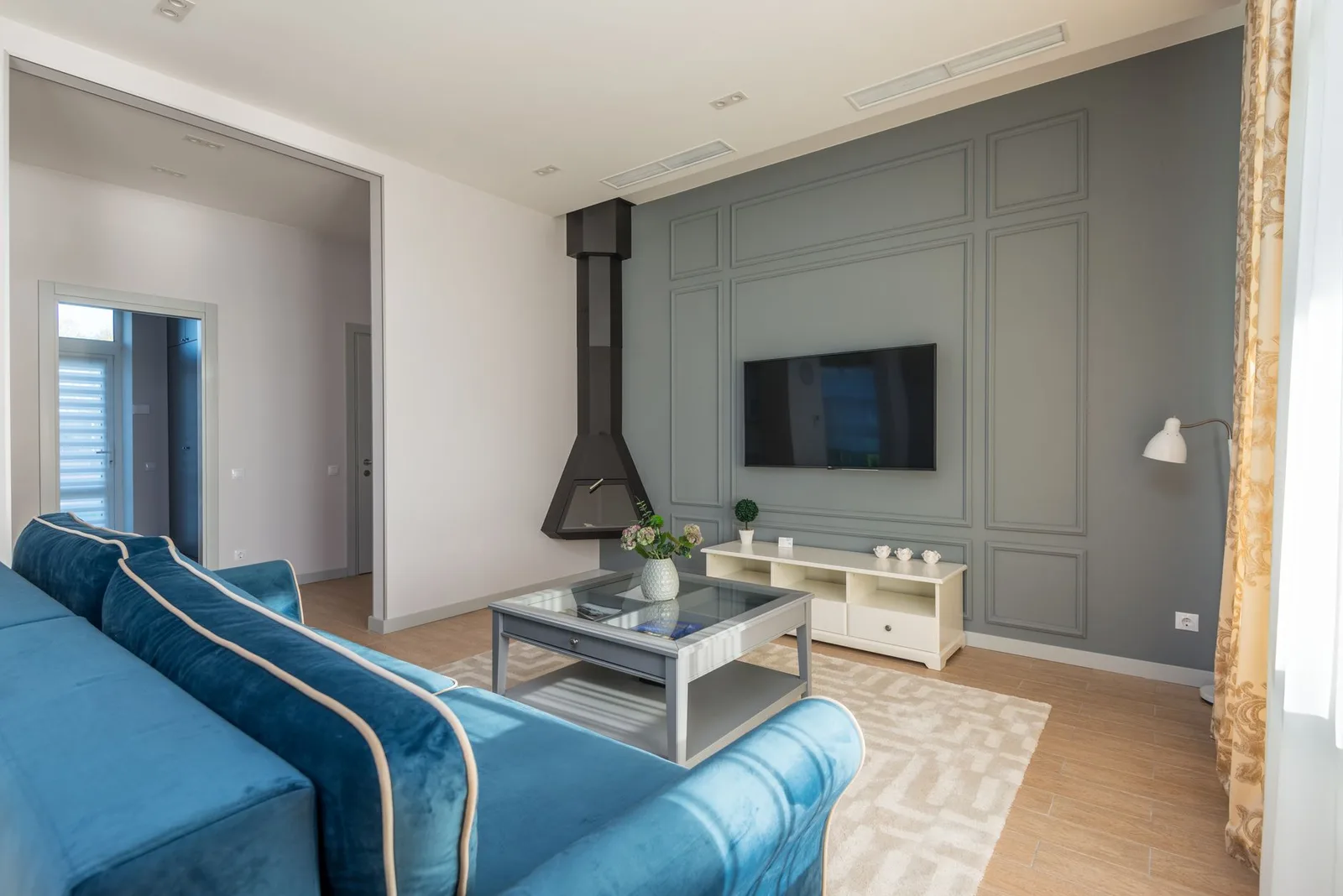 Television mounted on a living-room wall